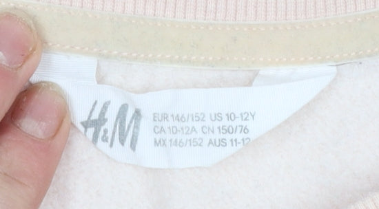 Brand and care label for H&M girls’ beige sequin music graphic pullover sweatshirt 11-12 years