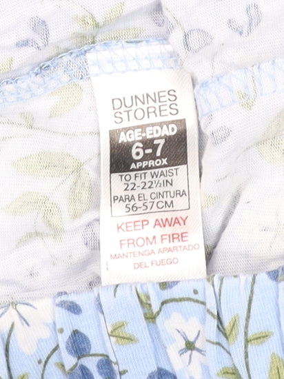 Brand and care label for Dunnes girls’ blue floral cotton elastic waist shorts age 6