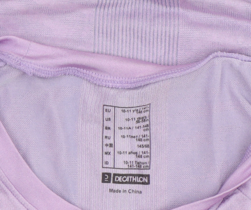 Brand and care label for Decathlon girls’ purple short sleeve sports t-shirt 10-11 years