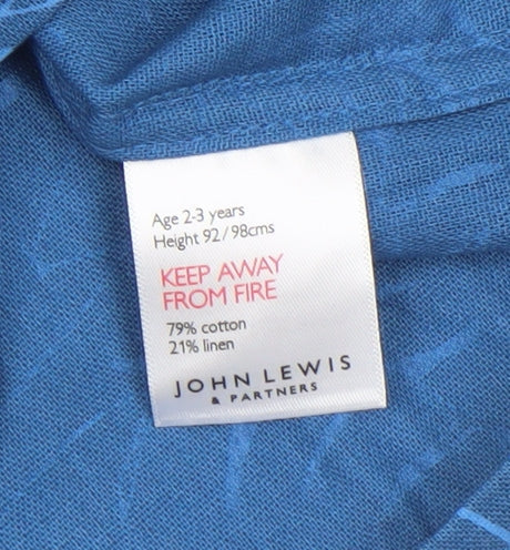 Brand and care label for John Lewis boys’ blue leaf print cotton linen button-up shirt 24 months