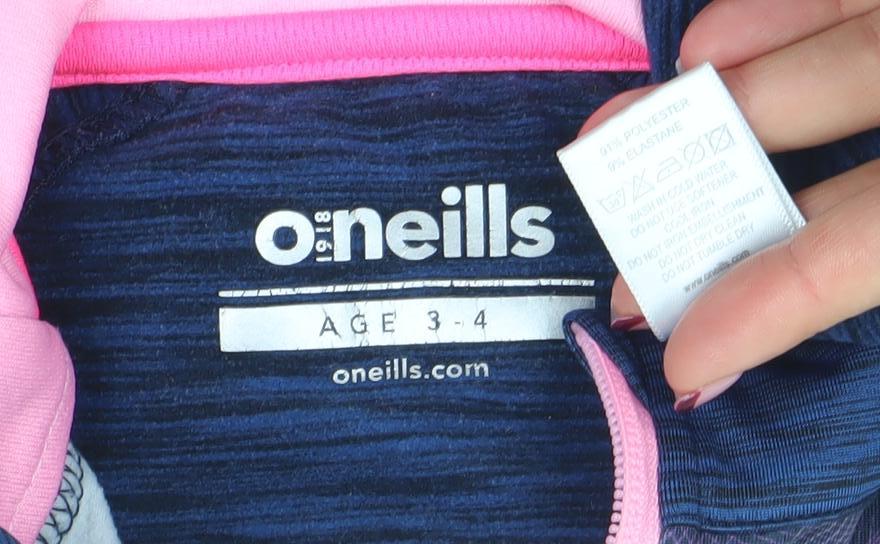 Brand and care label for O’Neills girls’ blue pink 1/4 zip long sleeve sports top age 3-4 years