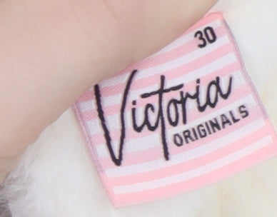 Brand and care label for Victoria Originals girls’ ivory faux fur sequin pullover sweatshirt 2 years