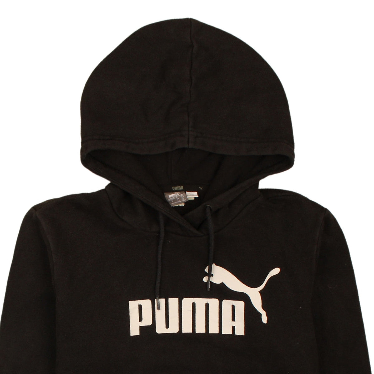 Brand and care label for Puma boys’ black pullover hoodie, size 12, years graphic logo fleece