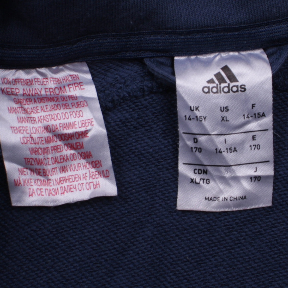 Close-up detail of Adidas girls’ navy full zip sweatshirt hoodie, size 14-15, years
