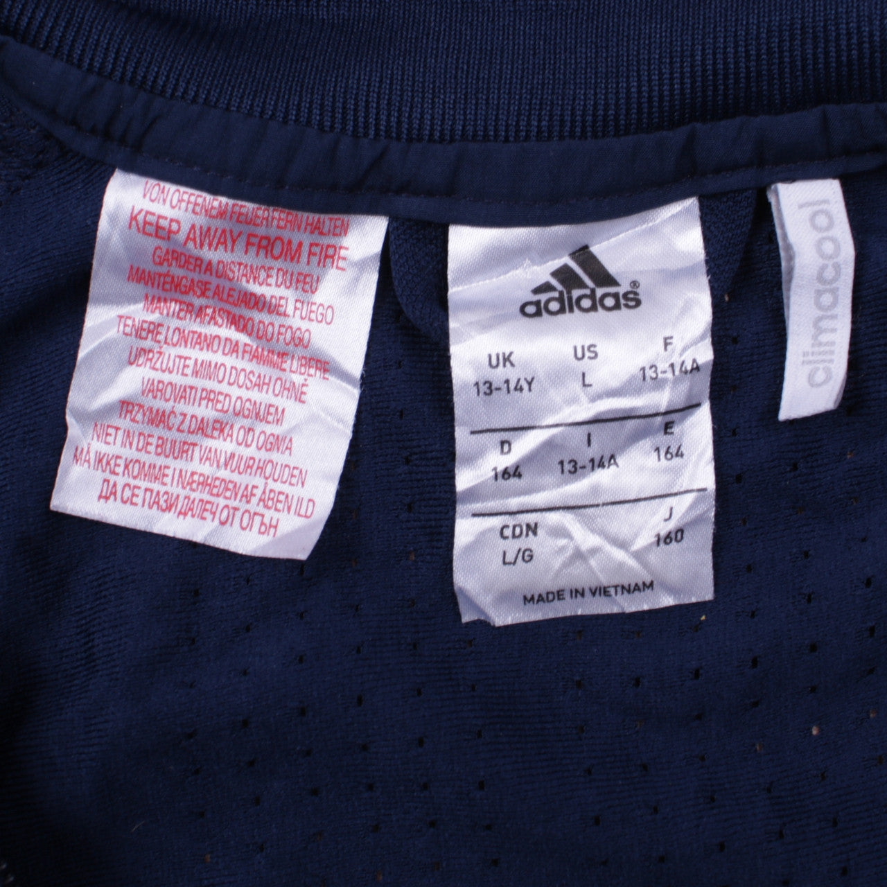 Close-up detail of Adidas boys’ blue full zip hoodie sweatshirt 13-14 years football climacool
