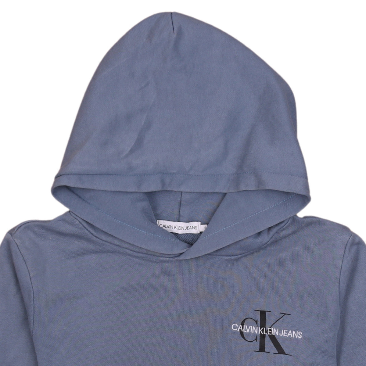 Brand and care label for Calvin Klein Jeans boys’ blue pullover hoodie 12 years logo cotton stretch