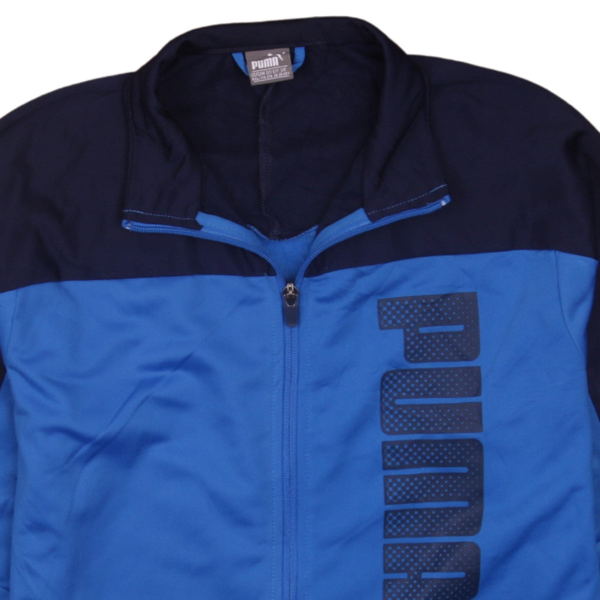 Brand and care label for Puma boys’ blue full zip sports sweatshirt, size 16, years