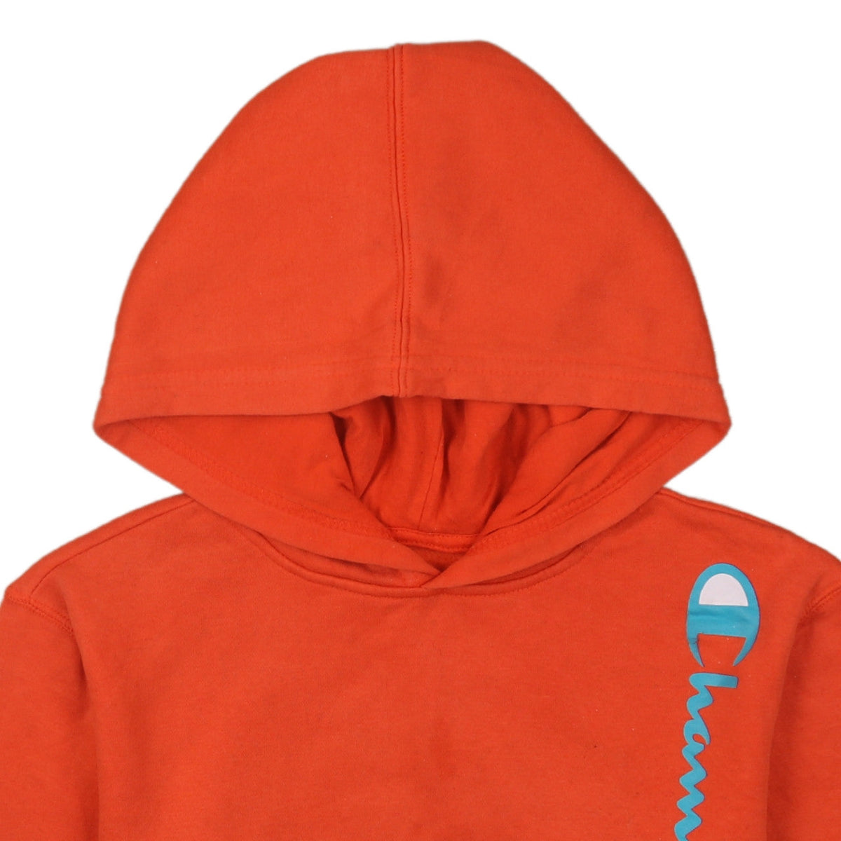 Brand and care label for Champion boys’ orange pullover hoodie, size L, cotton blend fleece sweatshirt