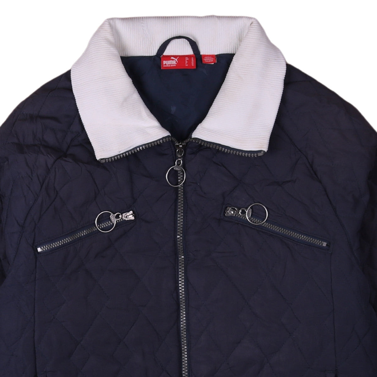 Brand and care label for Puma Women's Blue Quilted Full Zip Activewear Jacket, size 12