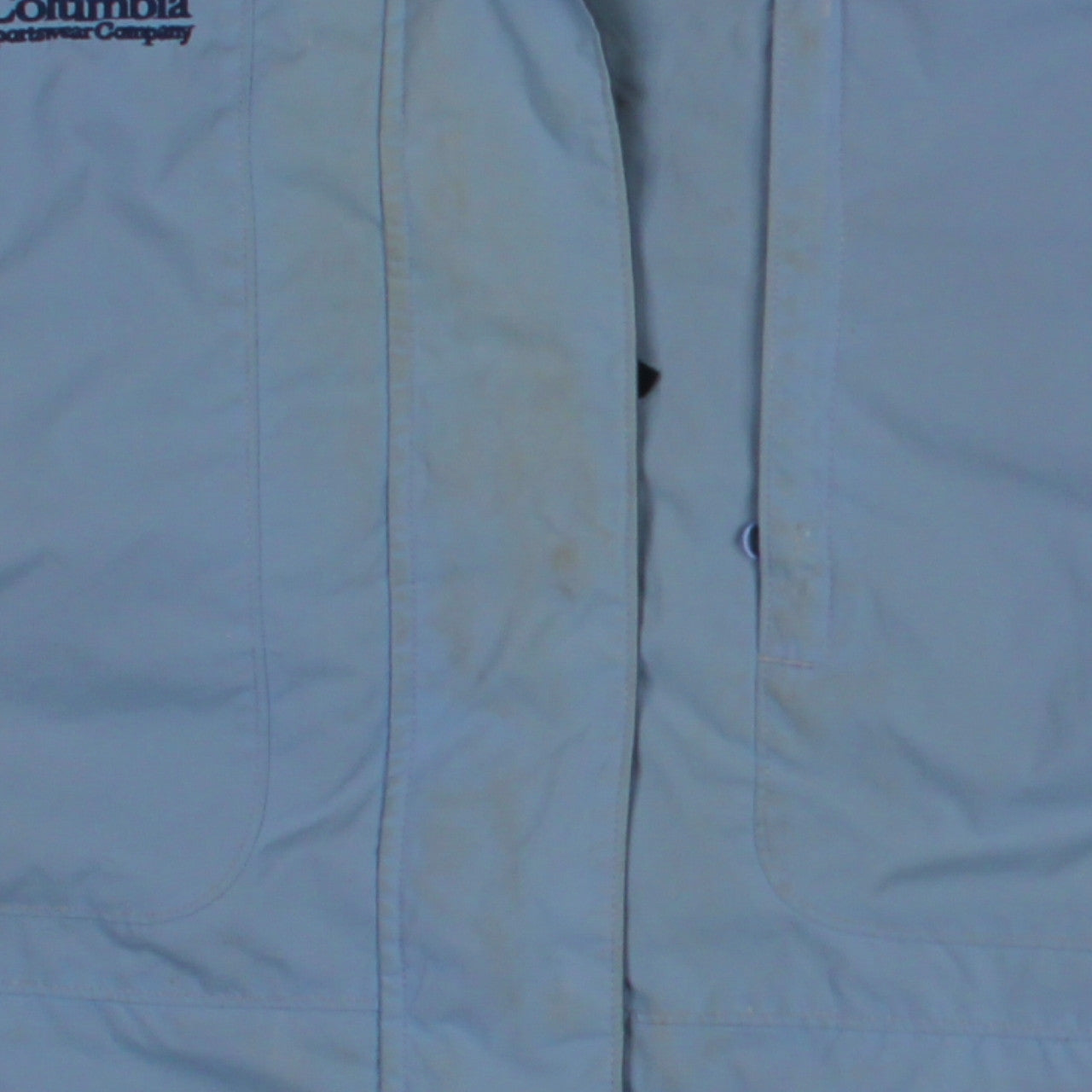 Brand and care label for Columbia unisex blue xl 3-in-1 waterproof hiking jacket
