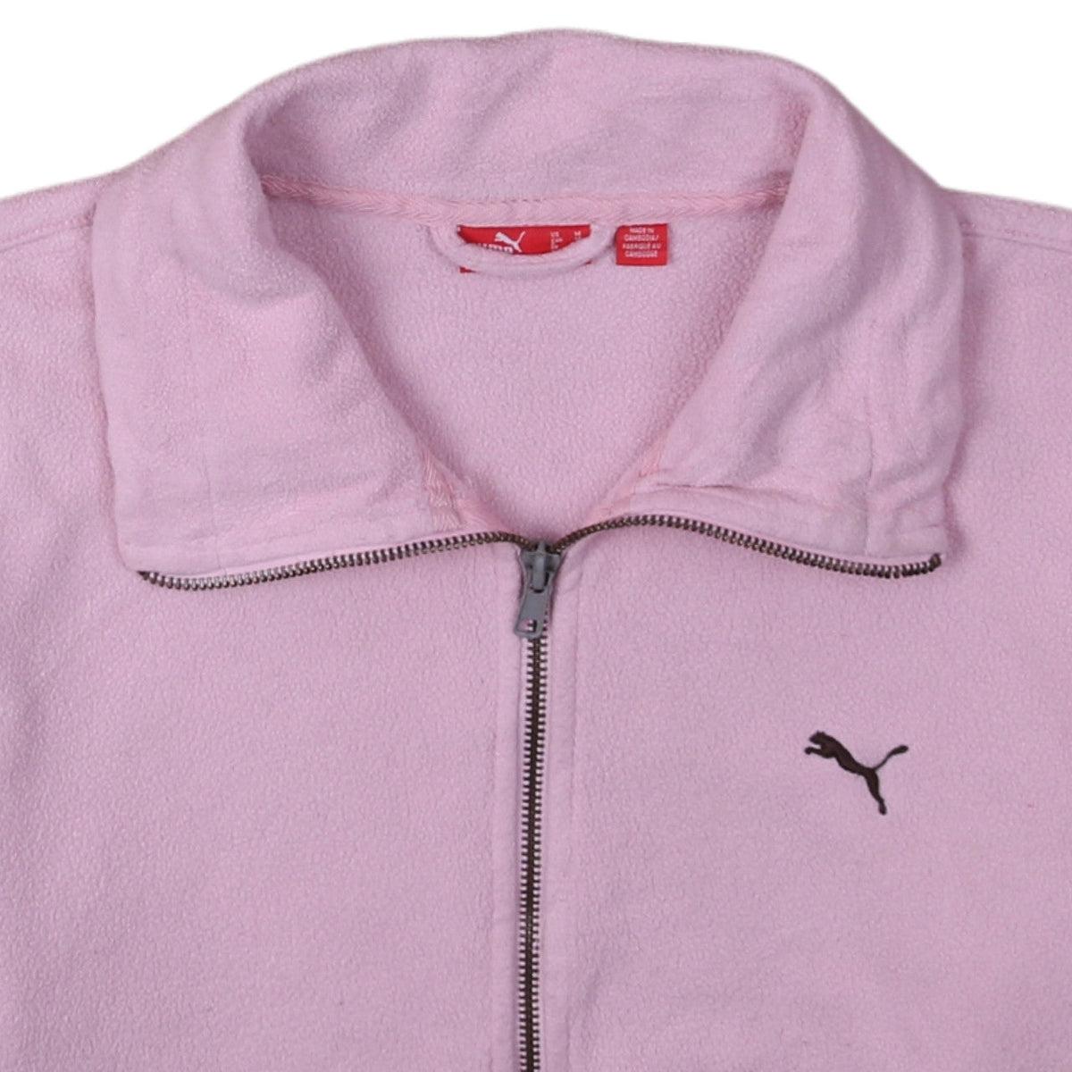 Brand and care label for Puma women’s pink fleece full zip jacket, size UK 12