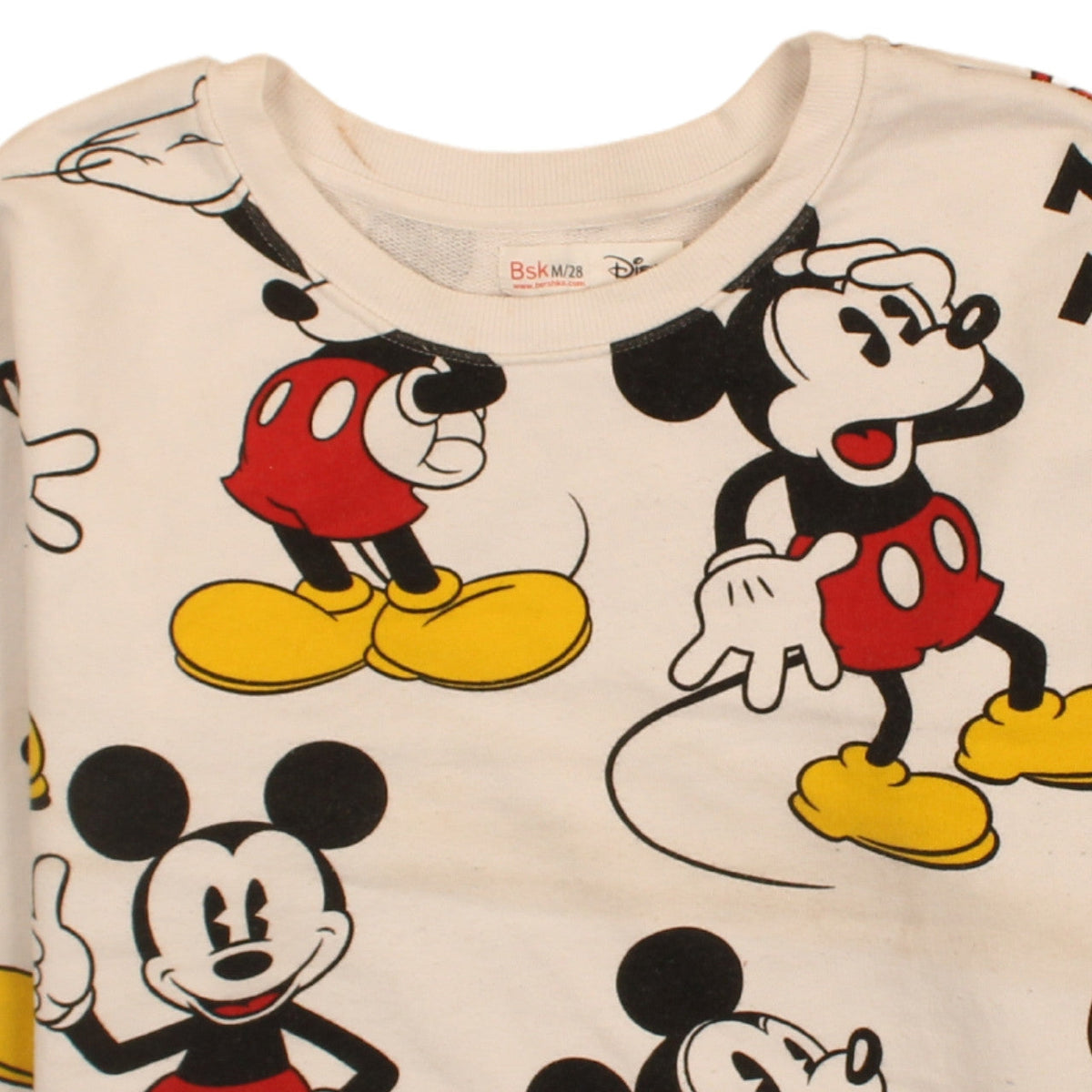 Brand and care label for Bershka Disney women’s beige mickey mouse sweatshirt, size M