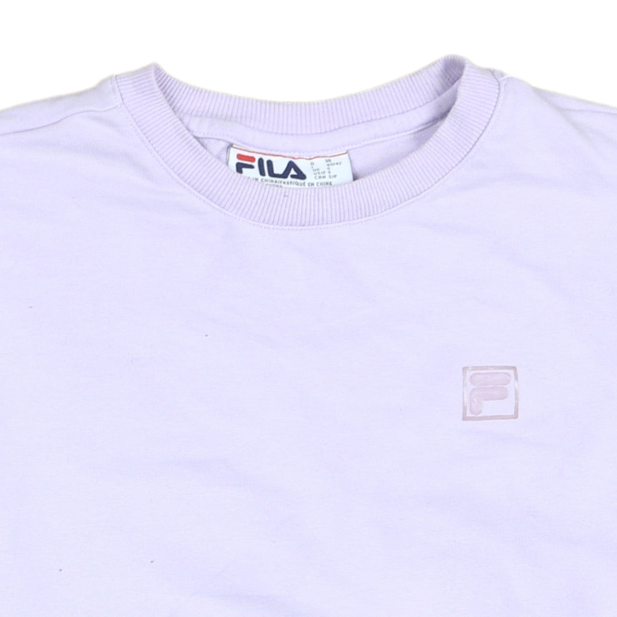 Brand and care label for Fila women’s lilac crew neck sweatshirt, size S, casual logo pullover