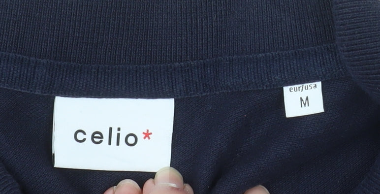 Brand and care label for Celio men’s blue cotton short sleeve polo shirt, size M