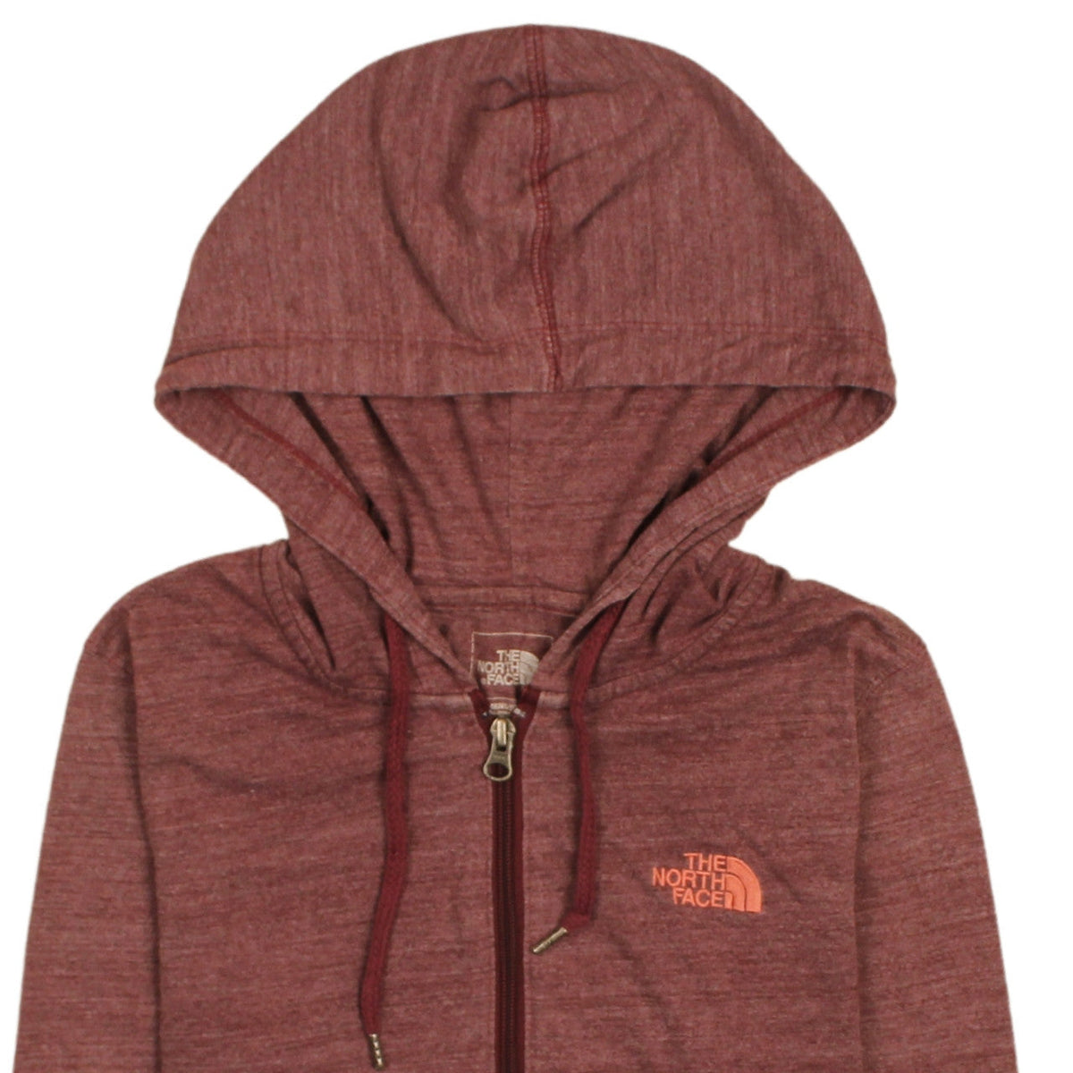 Brand and care label for The North Face women’s red full zip hoodie, size M, standard fit