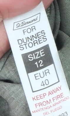 Brand and care label for St. Bernard for Dunnes Stores women’s green floral tie tunic blouse, size UK 12
