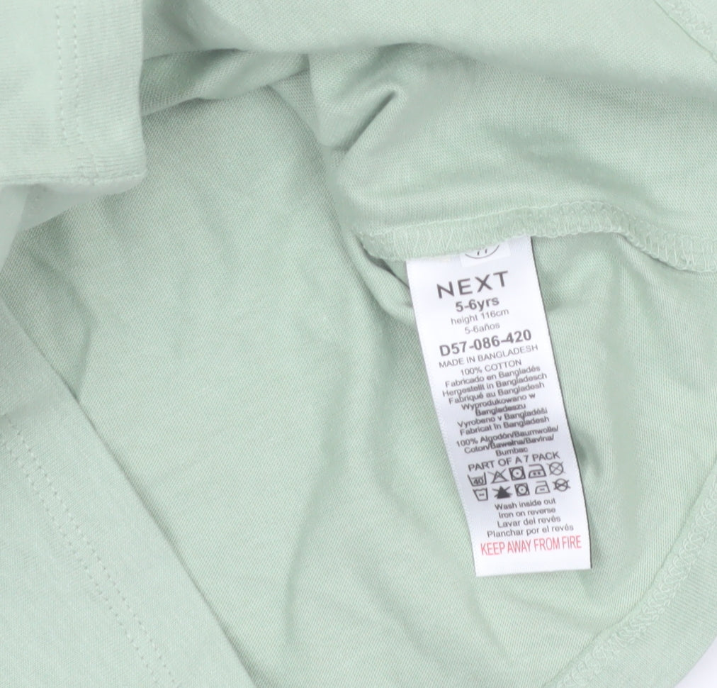 Brand and care label for Next girls’ green long sleeve cotton t-shirt 5-6 years basic crew neck