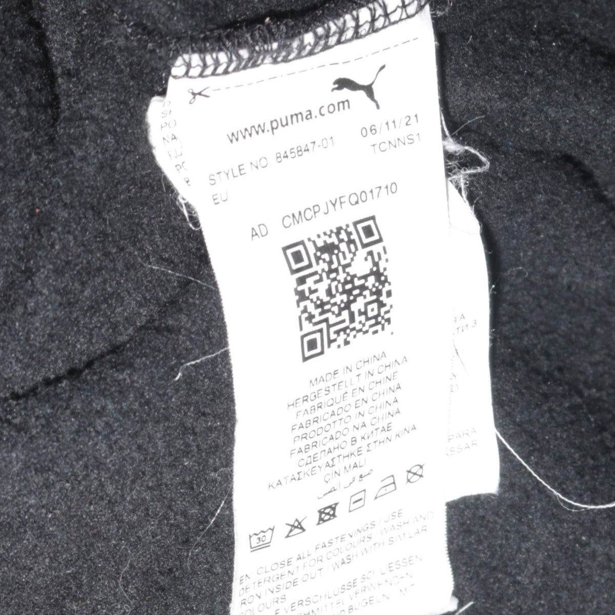 Brand and care label for Puma Men's Black Full Zip Hoodie Small Sportswear Fleece