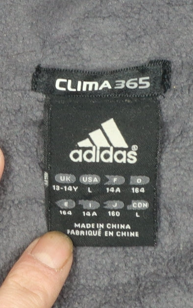 Brand and care label for Adidas boys’ navy blue clima365 lightweight full zip sports jacket, size L