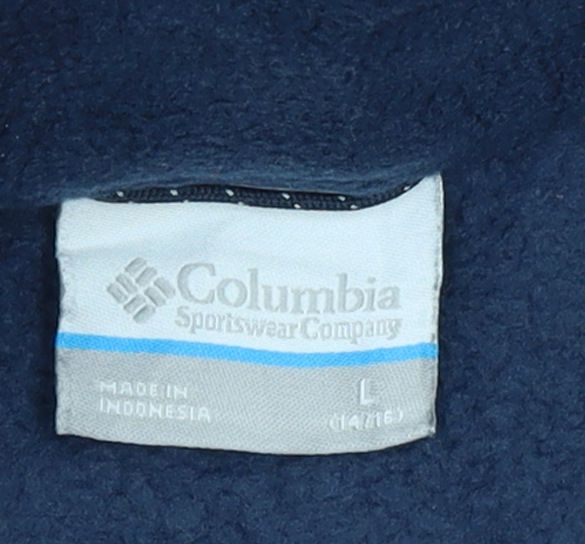 Brand and care label for Columbia boys’ blue fleece full zip outdoor jacket, size L