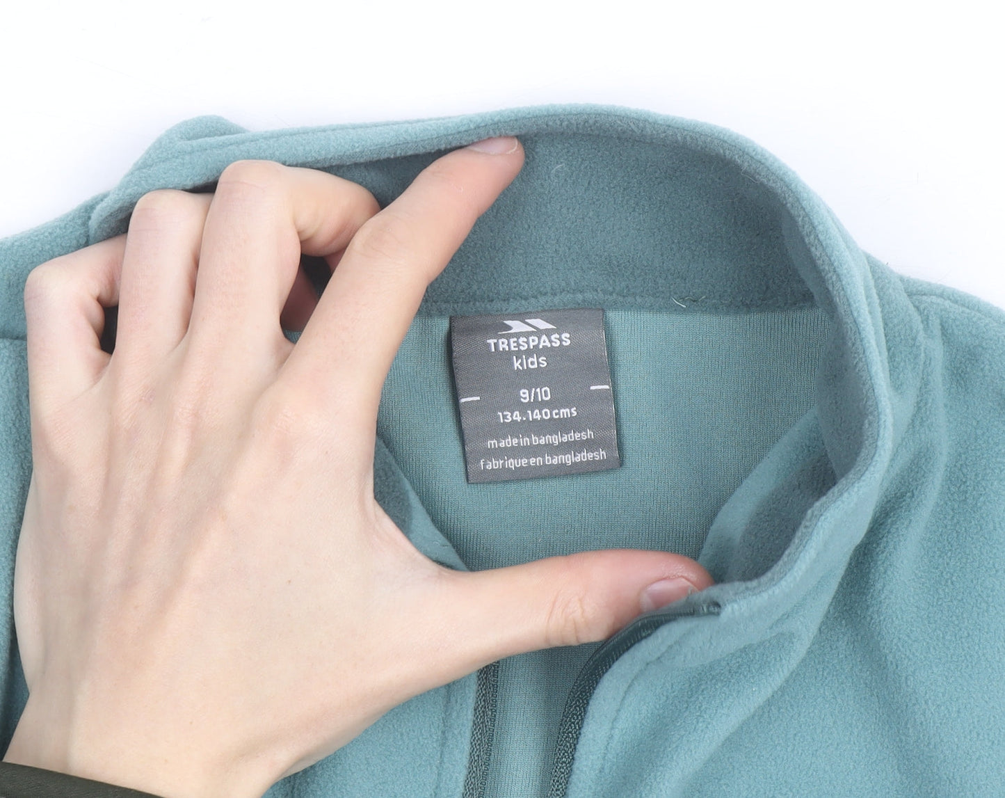 Brand and care label for Trespass Teens Green Fleece 1/2 Zip Lightweight Active Jacket 9 Slim