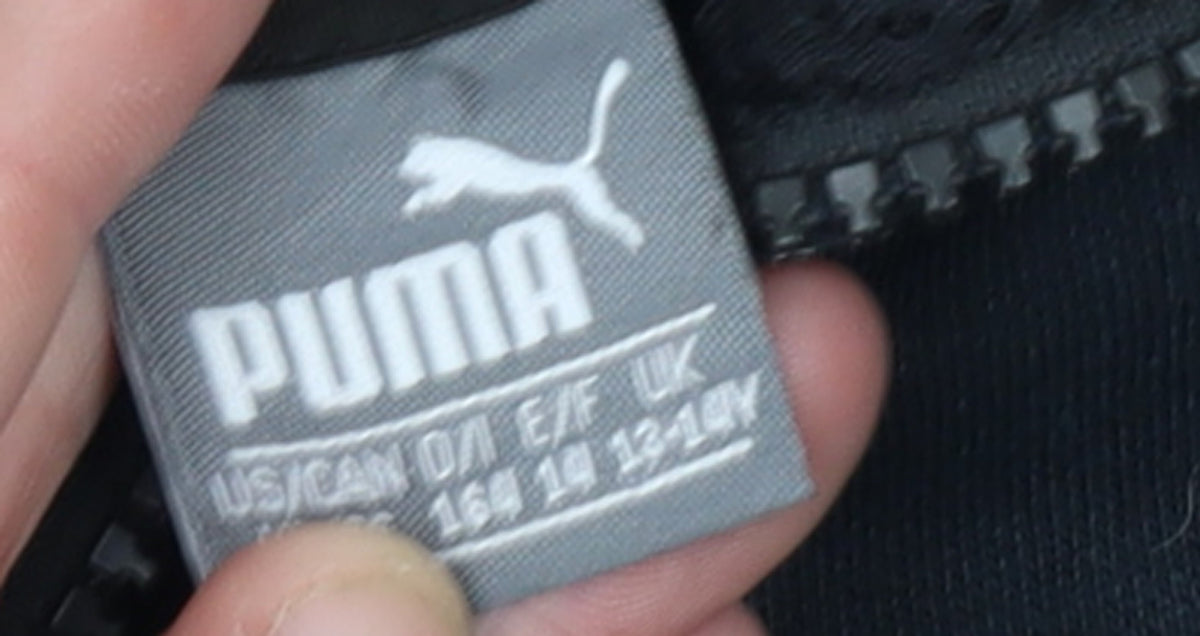 Brand and care label for Puma boys’ black full zip hoodie 13-14 years classic sportswear