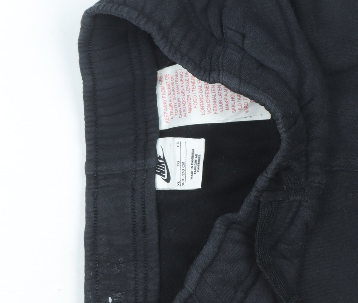 Brand and care label for Nike boys’ black xl jogger sweatpants fleece elastic waist comfort fit