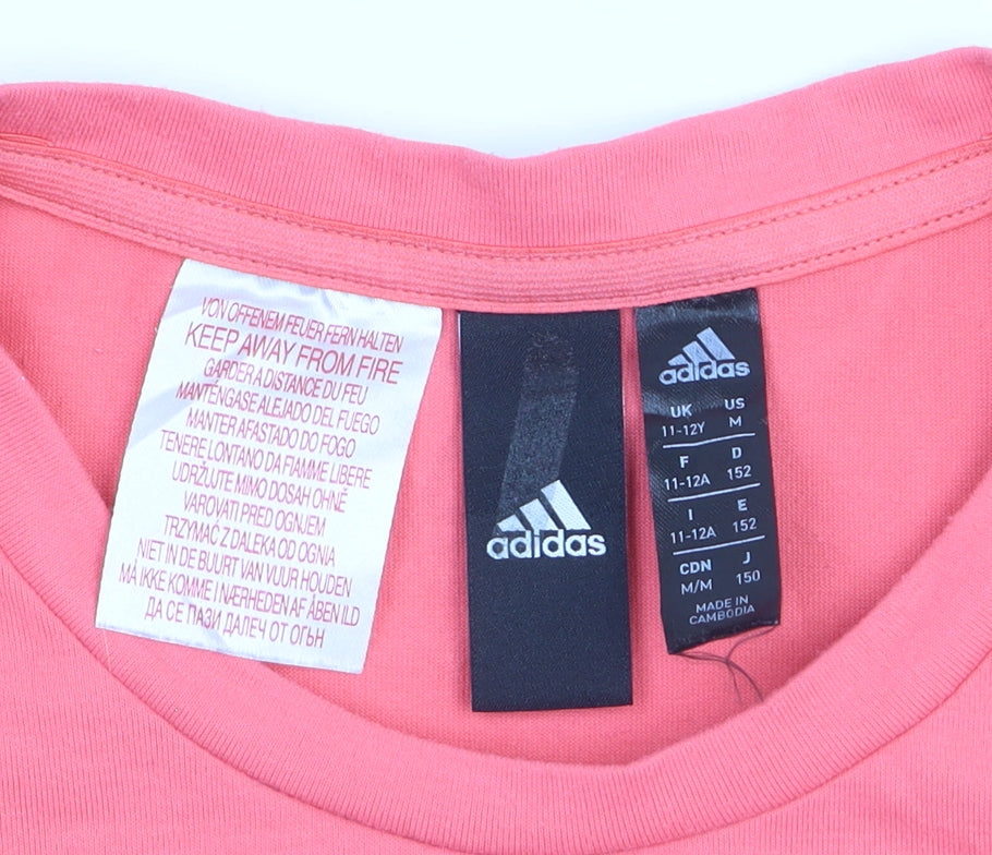 Brand and care label for Adidas girls’ coral pink crew neck short sleeve t-shirt 11-12 years
