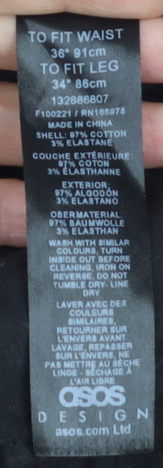 Brand and care label for ASOS Design Men's Black Chino Trousers 36W 34L Cotton Blend