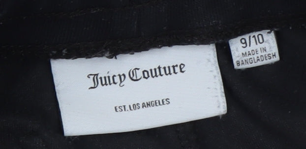 Brand and care label for Juicy Couture girls’ black velour jogger trousers age 9/10 with sparkle trim