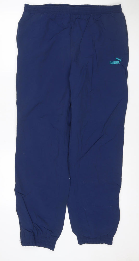 Additional front view of Puma men’s blue track pants l lightweight woven sports trousers