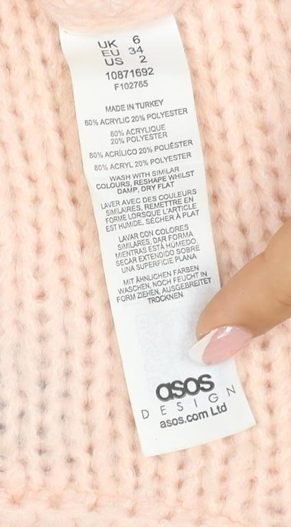 Brand and care label for ASOS DESIGN Women’s Pink UK 6 Chunky Knit Balloon Sleeve jumper