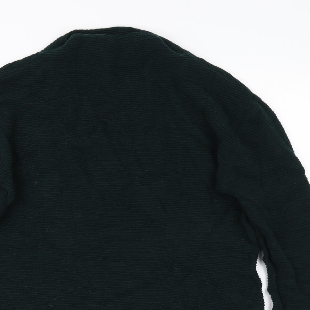 Close-up detail of donna women’s green jumper, size M