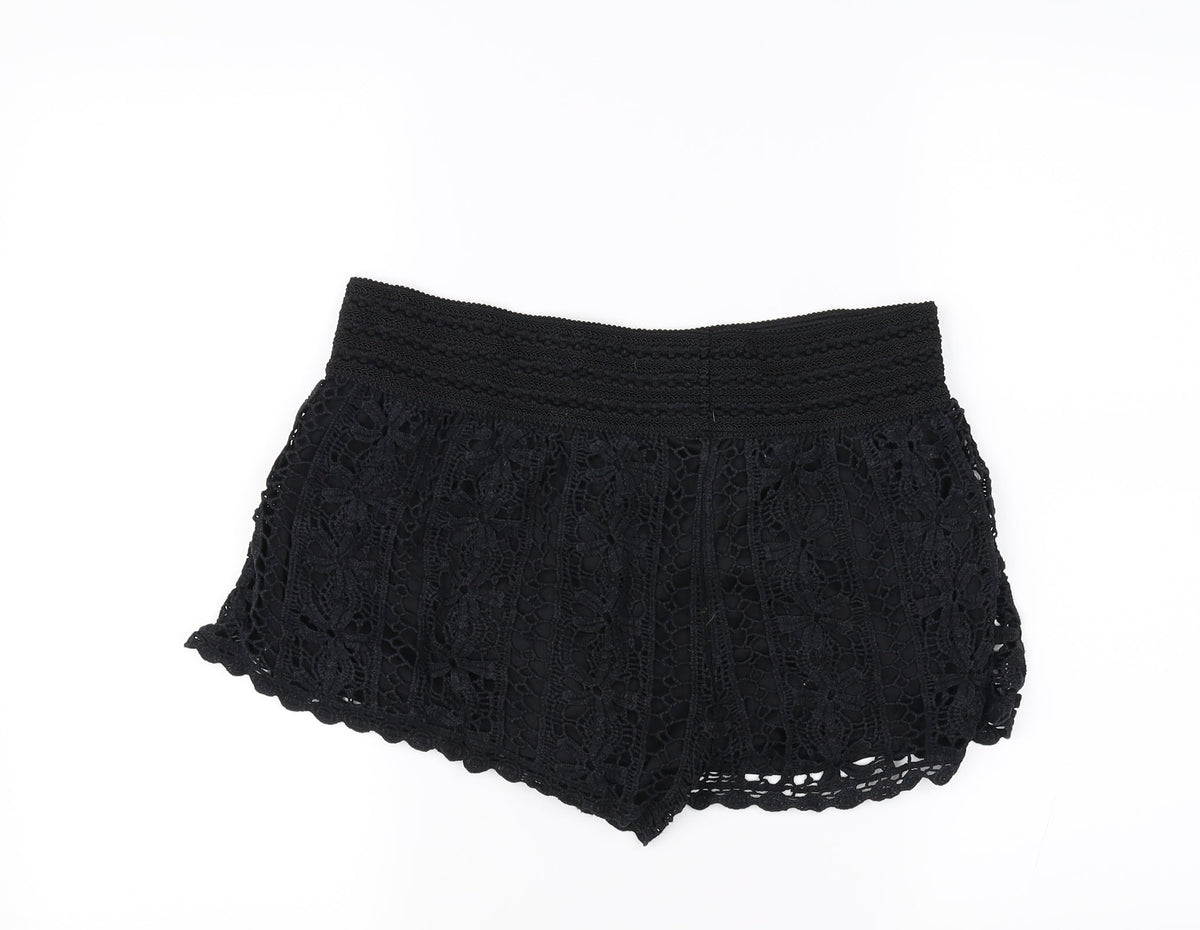 Back view of Rewind women’s black sweat shorts, size L
