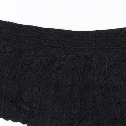 Brand and care label for Rewind women’s black sweat shorts, size L