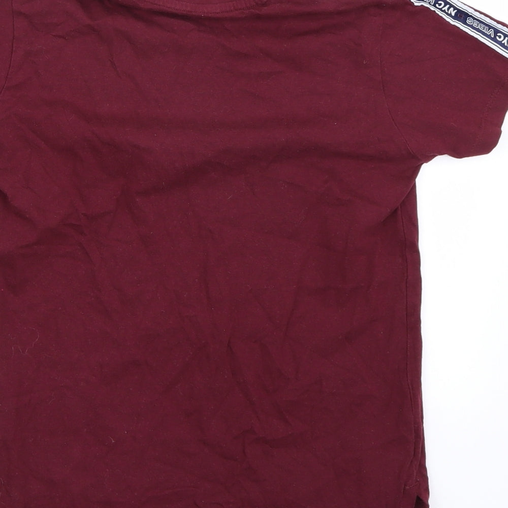 Brand and care label for Primark boys’ purple basic t-shirt, size 8, years