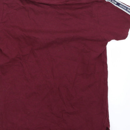 Brand and care label for Primark boys’ purple basic t-shirt, size 8, years