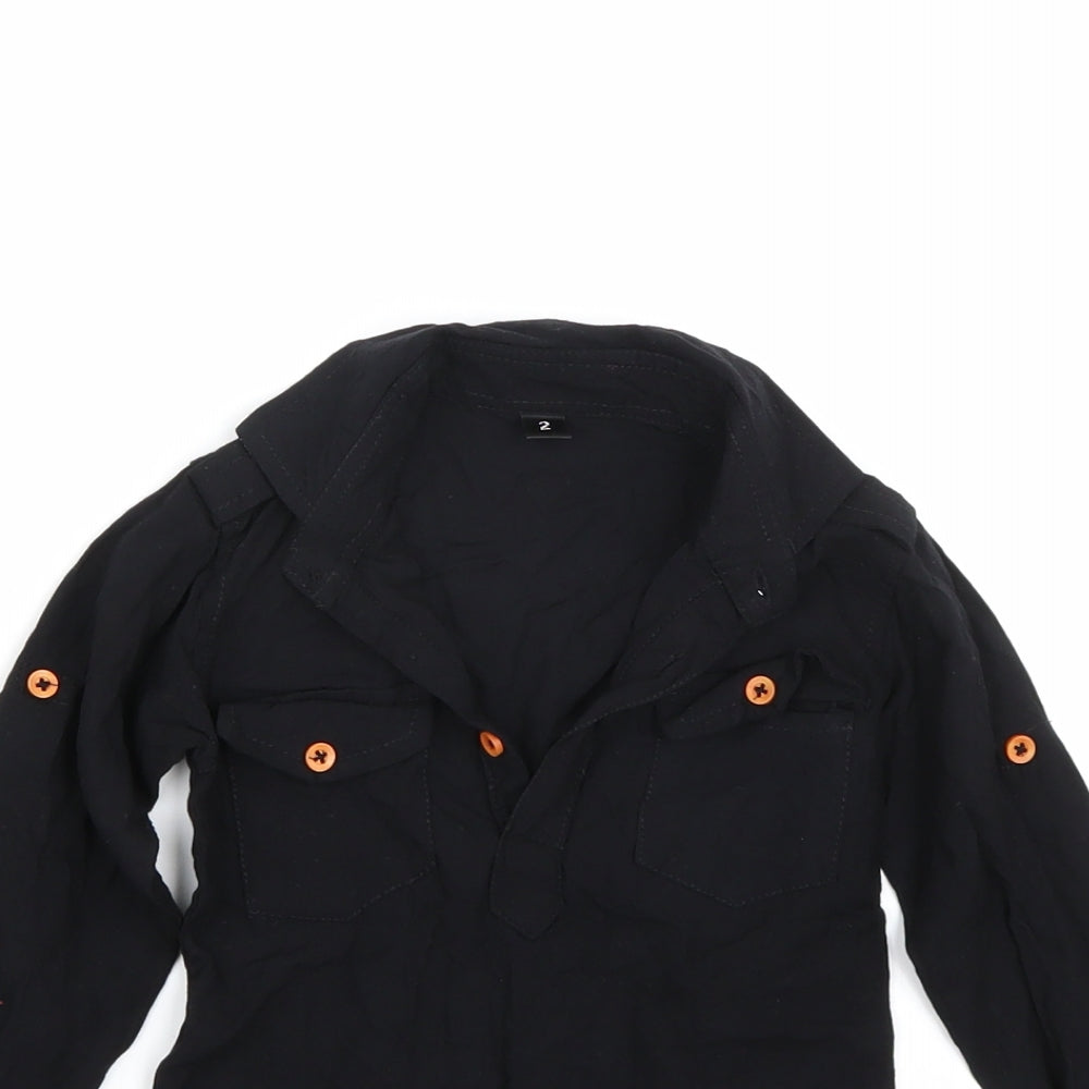 Close-up detail of Preworn girls’ black basic blouse, size 2, years