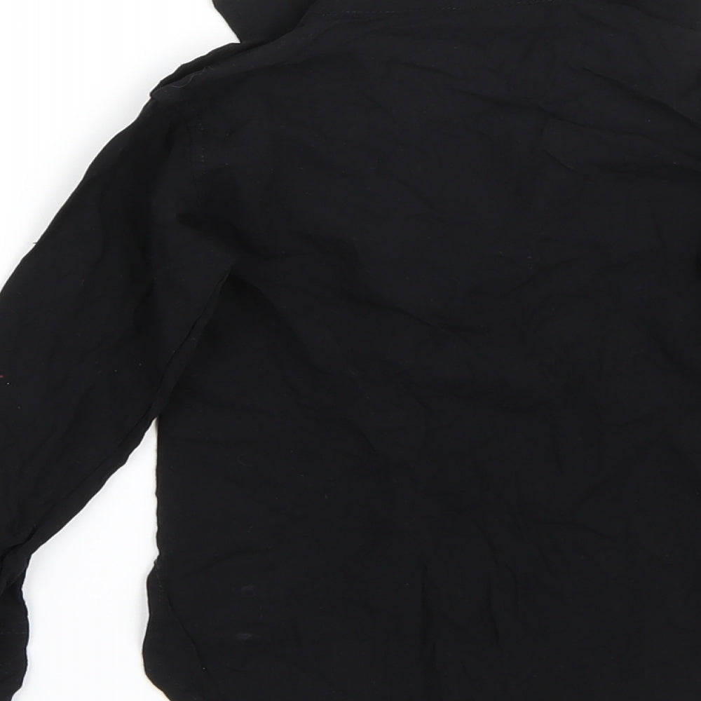 Brand and care label for Preworn girls’ black basic blouse, size 2, years
