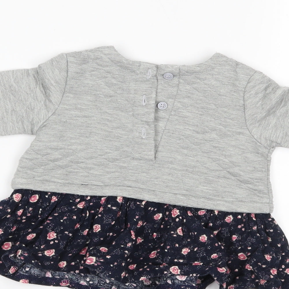 Brand and care label for Matalan girls’ grey jumper, size 0-3, months