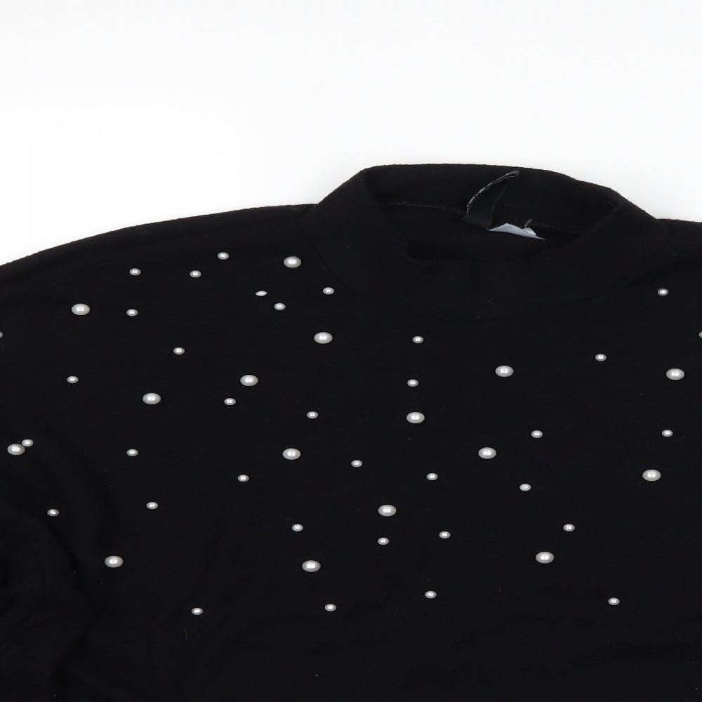Close-up detail of H&M women’s black jumper, size M