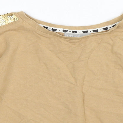 Close-up detail of Matalan girls’ beige basic t-shirt, size 7, years