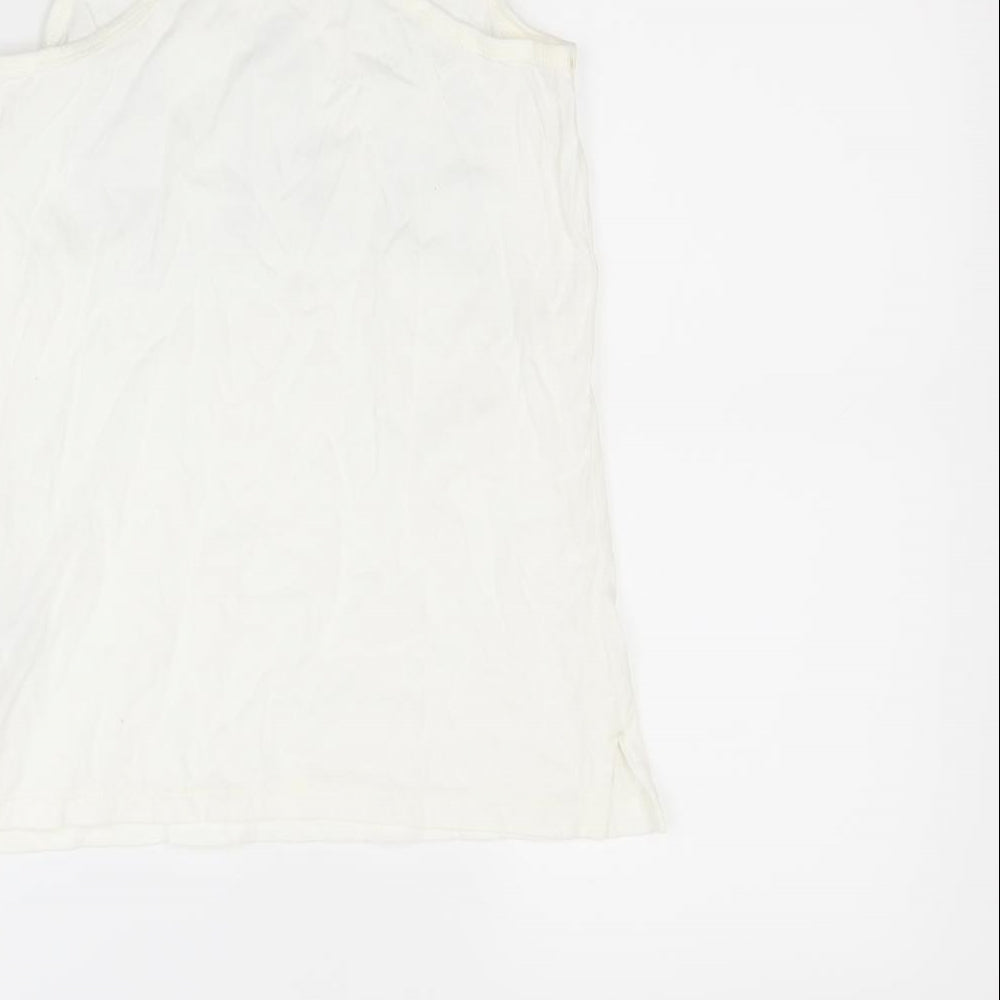 Brand and care label for Gap girls’ white basic tank, size 8, years