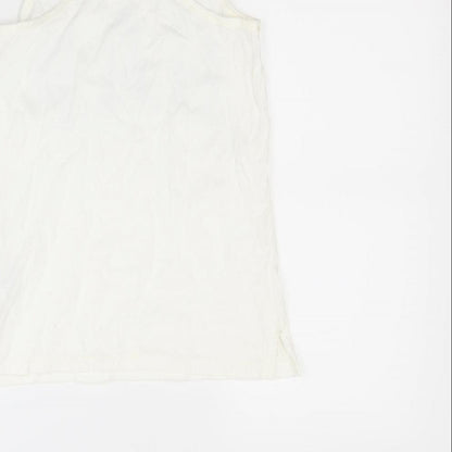 Brand and care label for Gap girls’ white basic tank, size 8, years