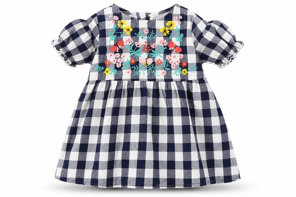 Front view of H&M girls’ blue check a-line, size 12, months