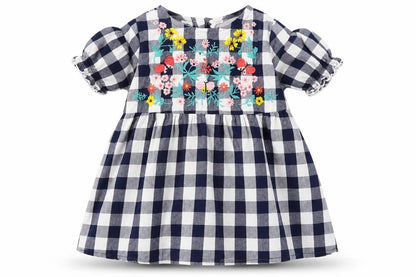 Front view of H&M girls’ blue check a-line, size 12, months