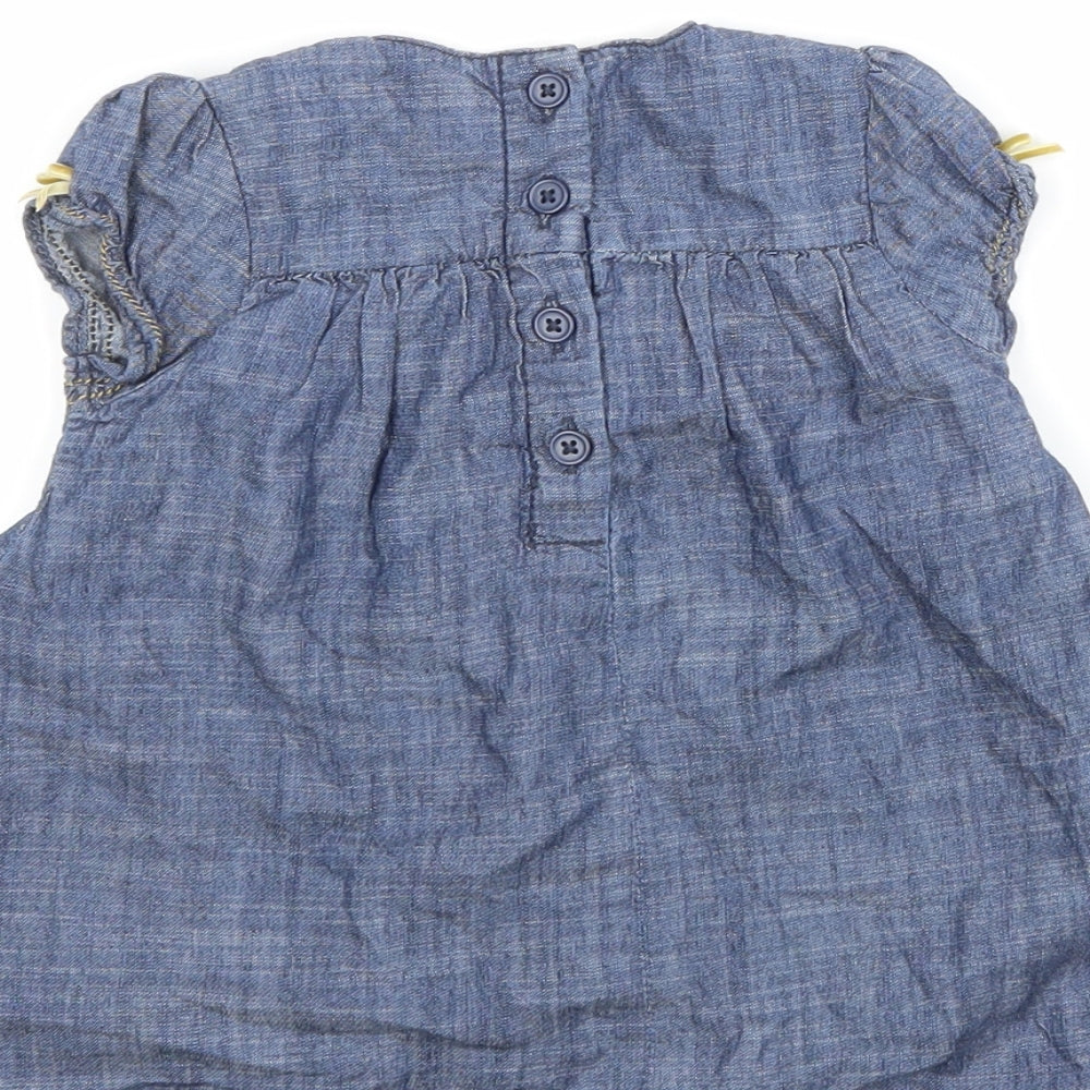 Brand and care label for Next Blue A-Line, size 6-9, Months