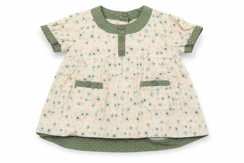 Front view of pre worn girls’ white fit & flare, size 9-12, months