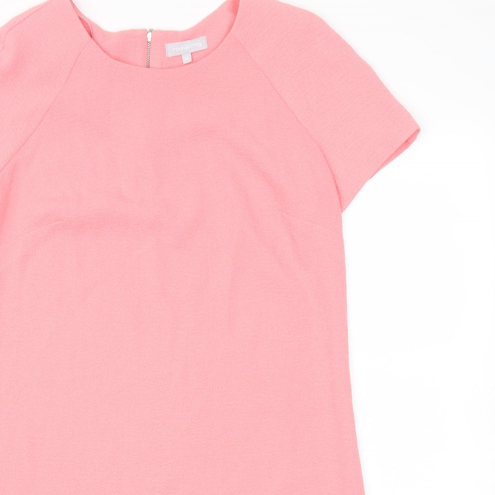 Close-up detail of Red Herring women’s orange fit & flare, size UK 10