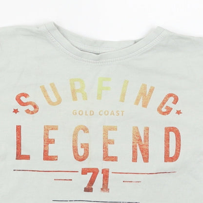 Close-up detail of Primark boys’ green basic t-shirt, size 3-4, years - surfing legend